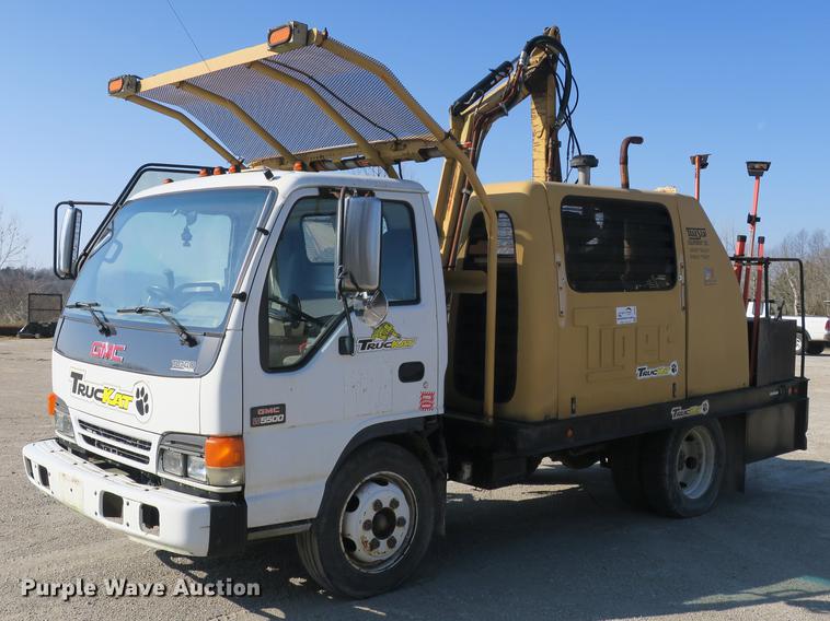 image for item DB8868 2003 GMC W5500 TrucKat flatbed truck