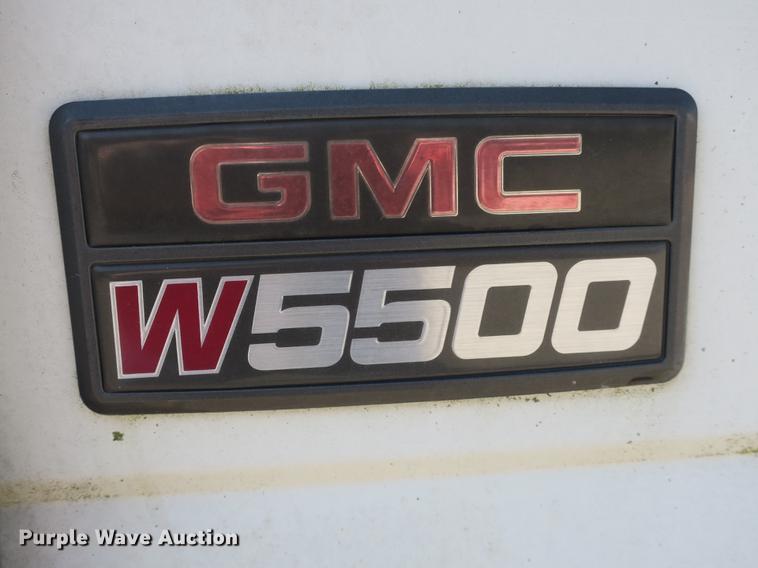 image for item DB8868 2003 GMC W5500 TrucKat flatbed truck