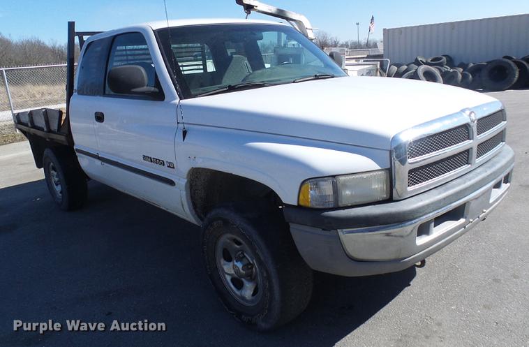 image for item DF7157 1999 Dodge Ram 1500 Ext. Cab flatbed pickup truck