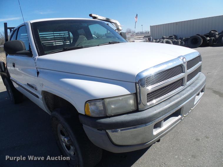 image for item DF7157 1999 Dodge Ram 1500 Ext. Cab flatbed pickup truck