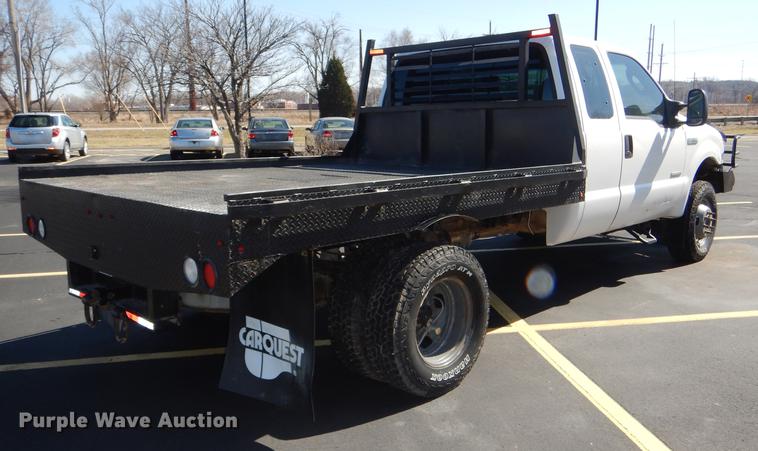 image for item DE0083 2007 Ford F350 Super Duty XL SuperCab flatbed pickup truck