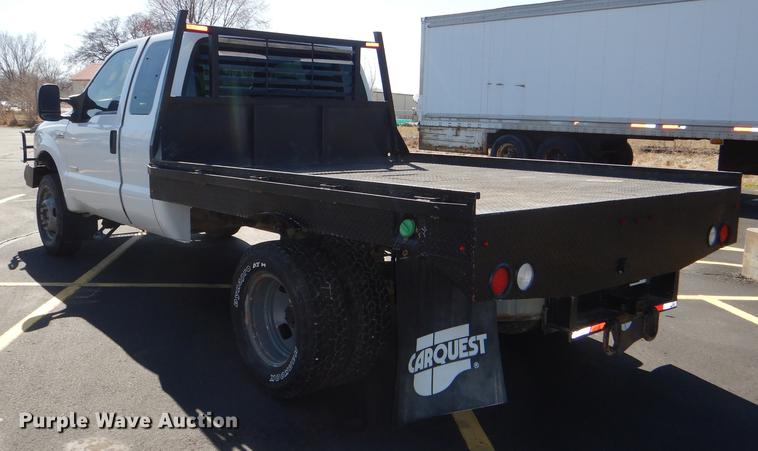 image for item DE0083 2007 Ford F350 Super Duty XL SuperCab flatbed pickup truck
