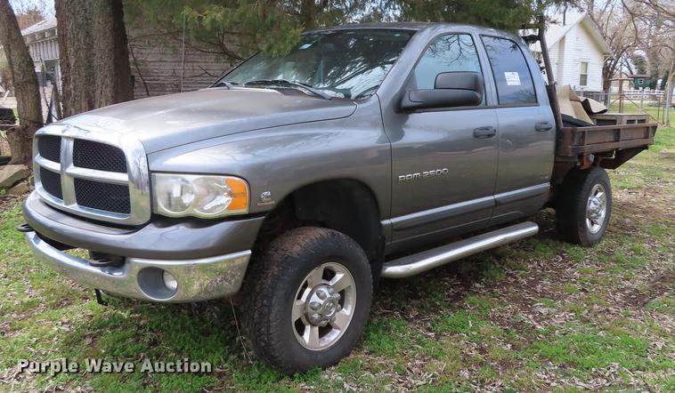 image for item DF1348 2005 Dodge Ram 2500 Quad Cab flatbed pickup truck