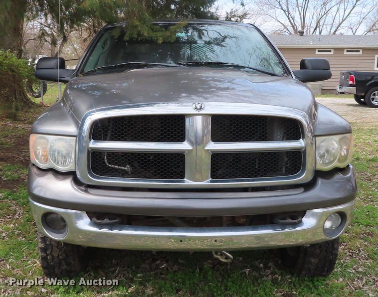 image for item DF1348 2005 Dodge Ram 2500 Quad Cab flatbed pickup truck