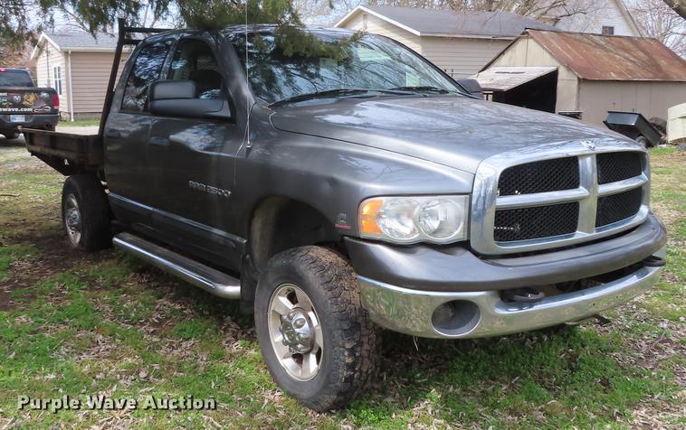 image for item DF1348 2005 Dodge Ram 2500 Quad Cab flatbed pickup truck