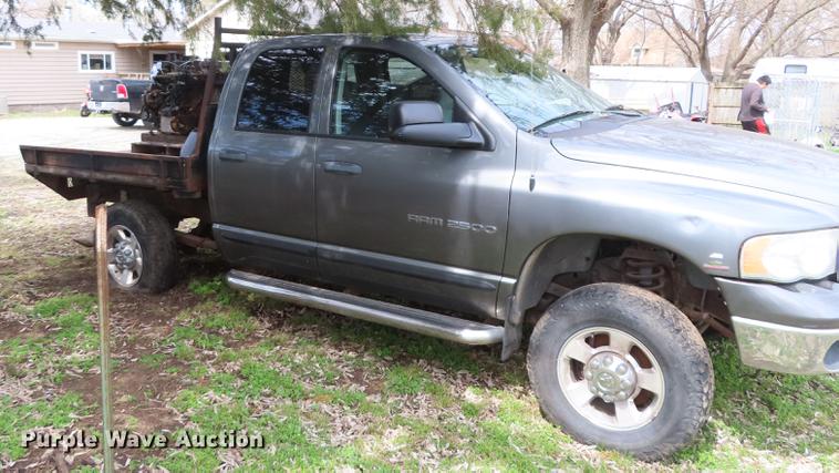 image for item DF1348 2005 Dodge Ram 2500 Quad Cab flatbed pickup truck
