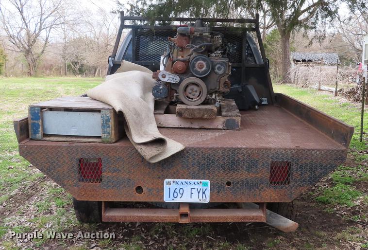 image for item DF1348 2005 Dodge Ram 2500 Quad Cab flatbed pickup truck