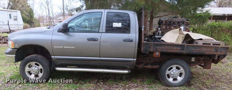 image for item DF1348 2005 Dodge Ram 2500 Quad Cab flatbed pickup truck