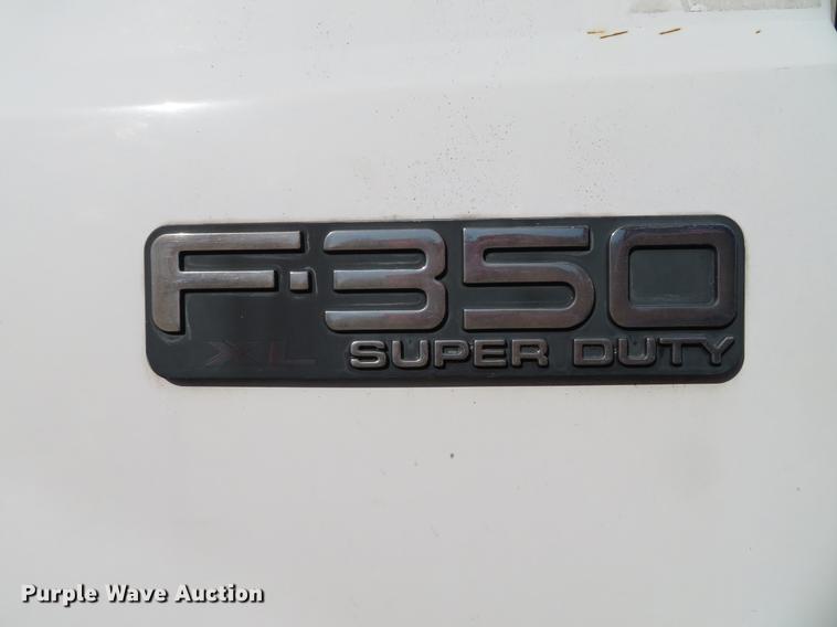 image for item DG3913 2000 Ford F350 Super Duty XL flatbed pickup truck