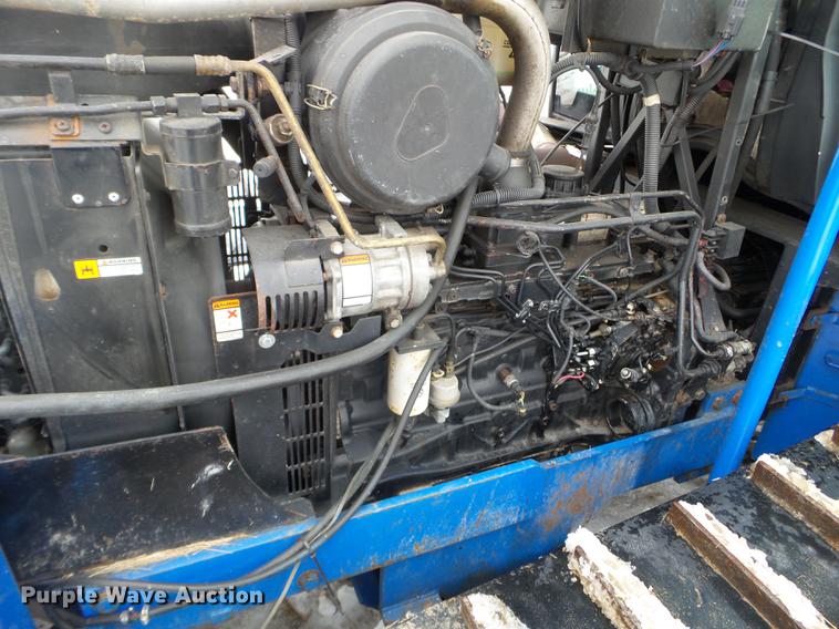 image for item EW9993 2005 New Holland TS115A tractor with snow groomer