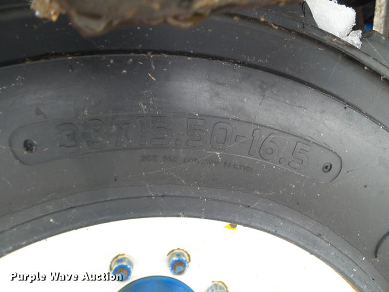 image for item EW9993 2005 New Holland TS115A tractor with snow groomer