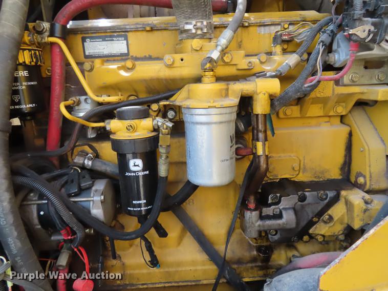 image for item DN9036 2004 John Deere 670CH motor grader