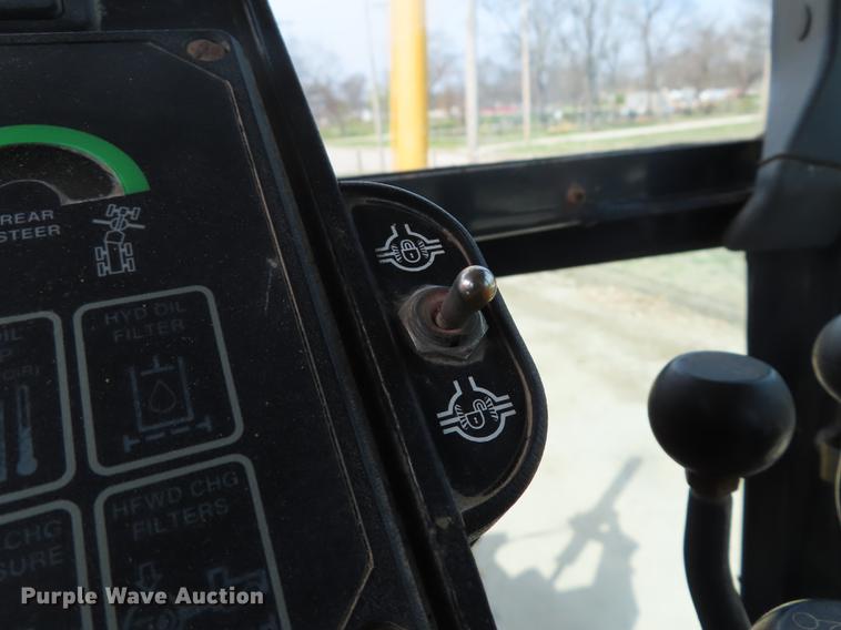 image for item DN9036 2004 John Deere 670CH motor grader