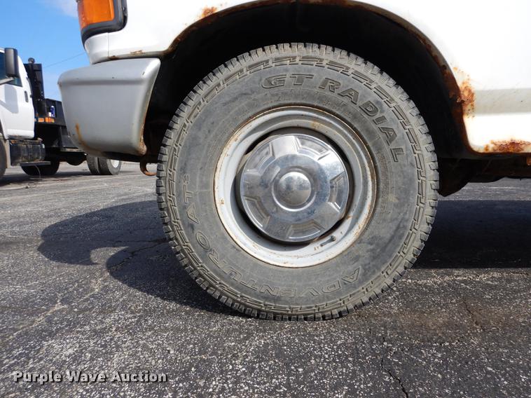 image for item DC8734 1997 Ford F250 flatbed pickup truck