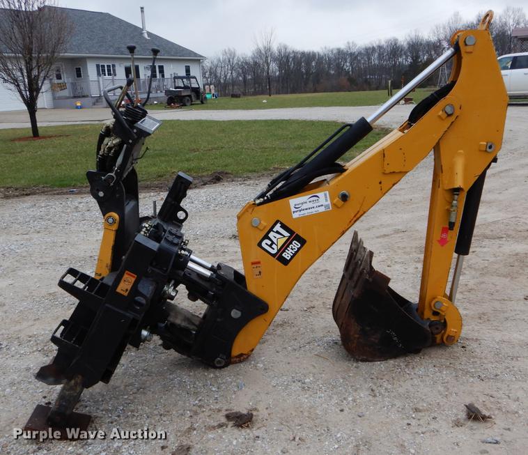 image for item DE6082 Caterpillar BH30 skid steer backhoe attachment