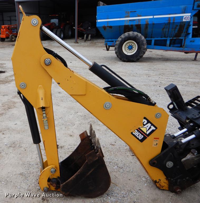 image for item DE6082 Caterpillar BH30 skid steer backhoe attachment