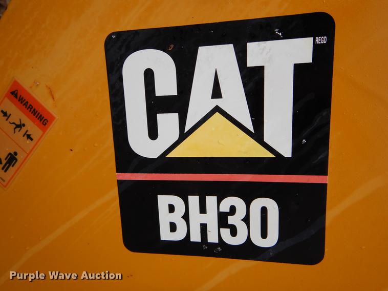 image for item DE6082 Caterpillar BH30 skid steer backhoe attachment