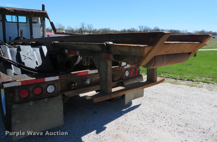 image for item DG3958 2000 Volvo WB roll-off container truck