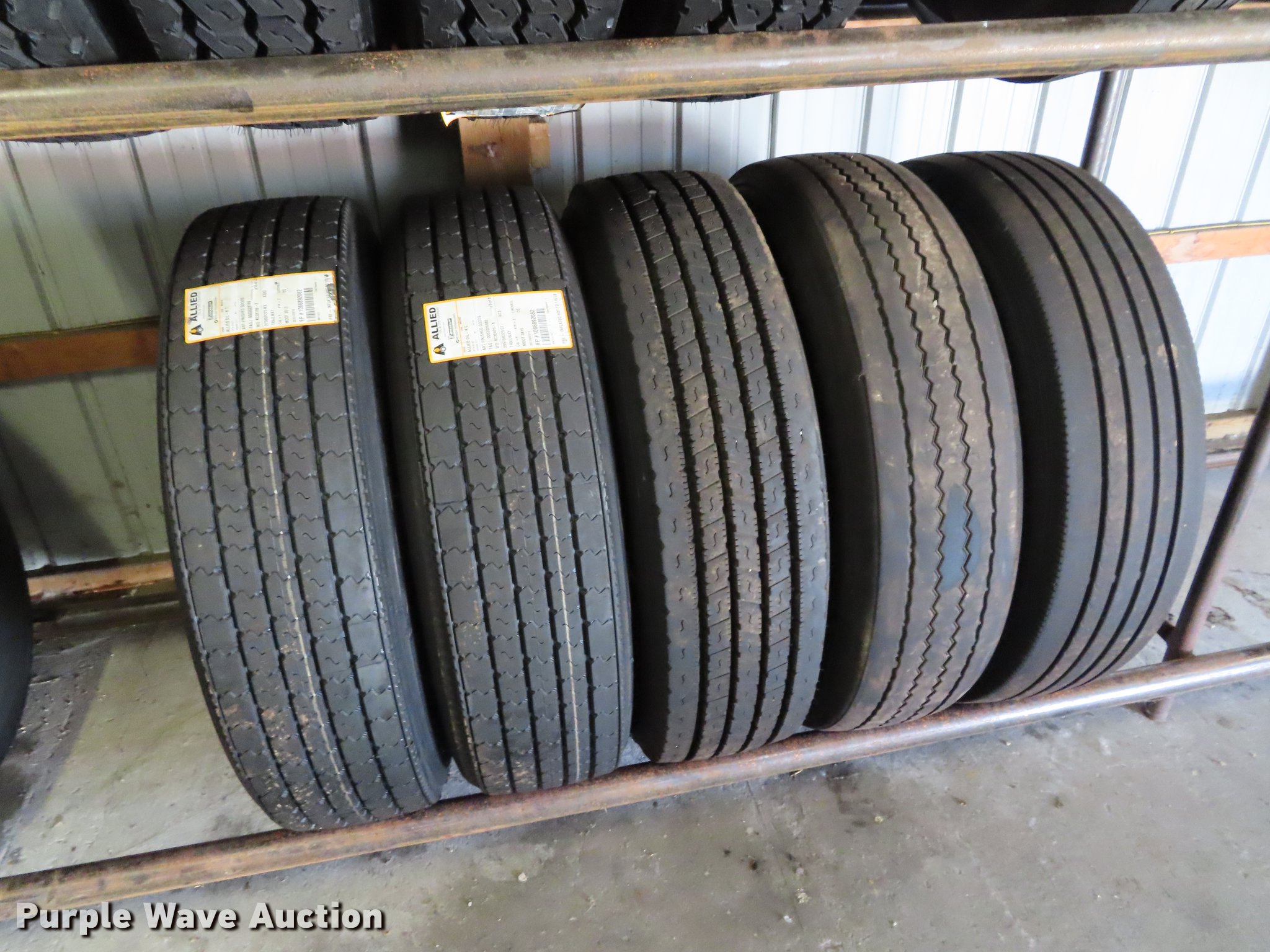 Tire rack and tires in Saint Joseph, MO Item DI9466 sold Purple Wave