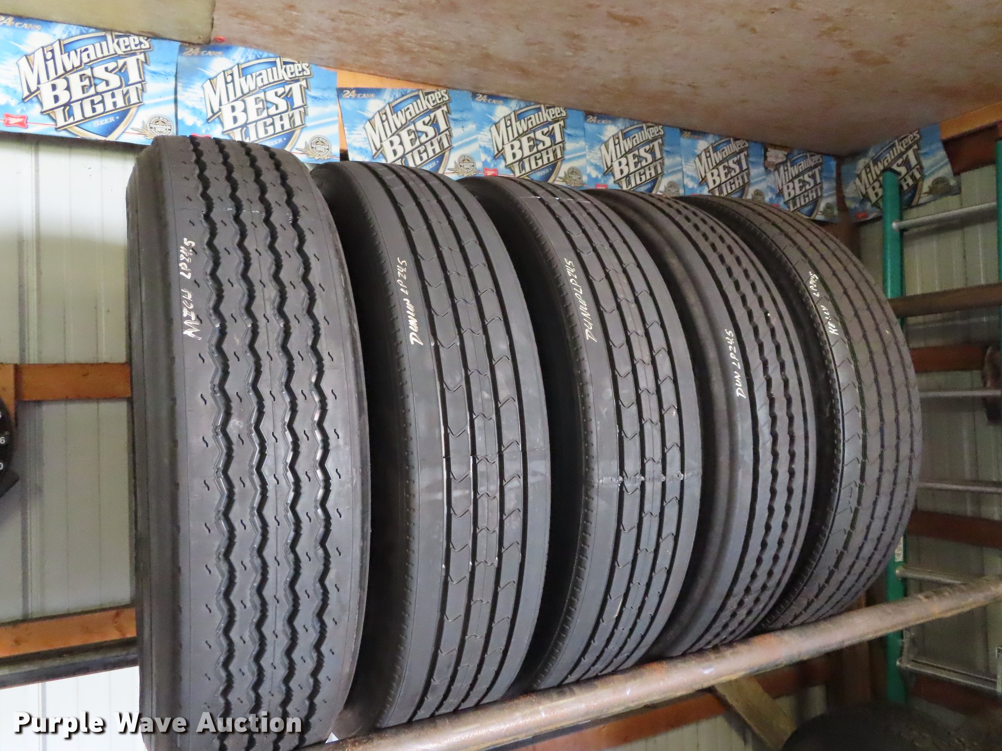 Tire rack and tires in Saint Joseph, MO Item DI9466 sold Purple Wave