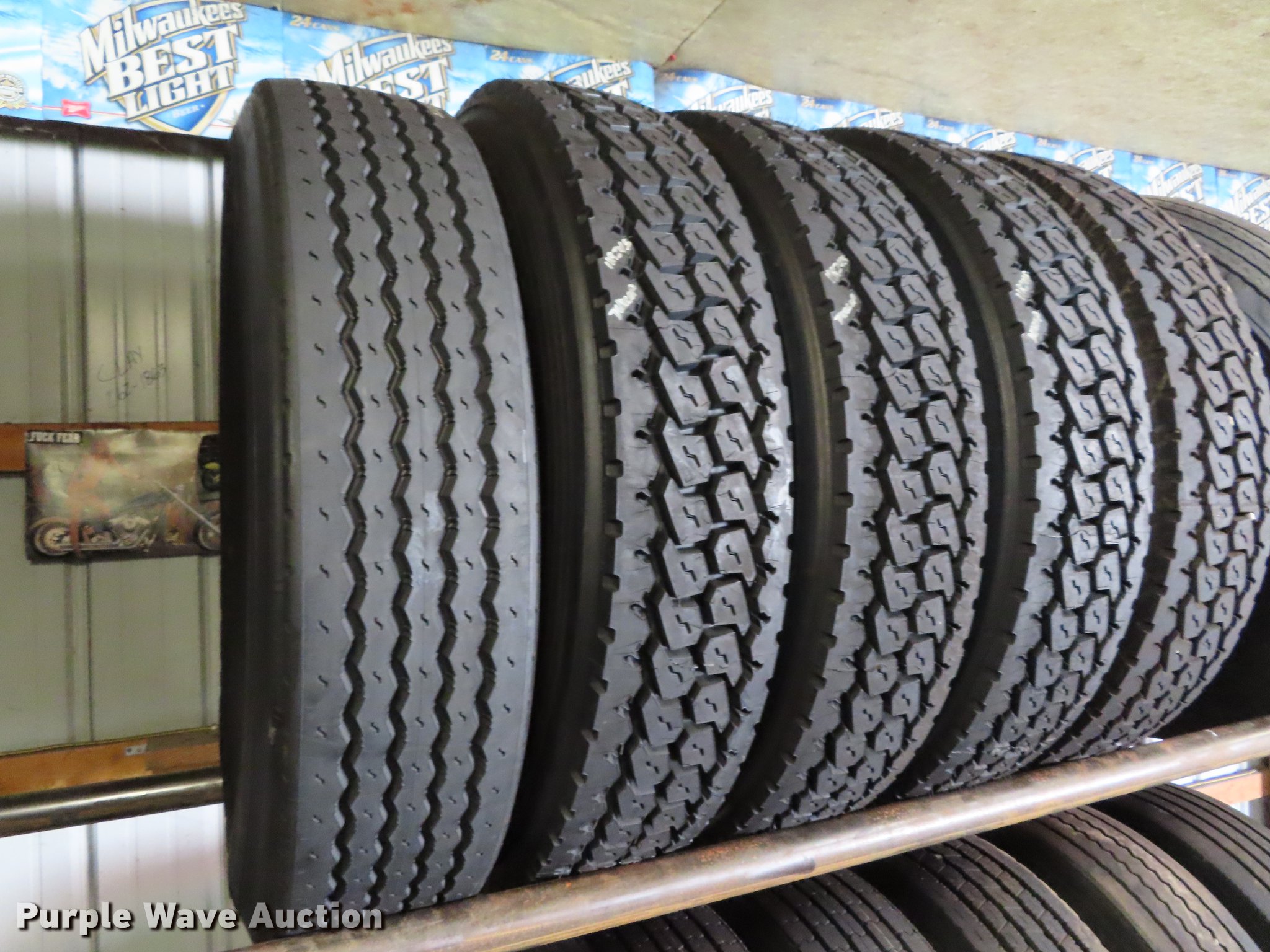 Tire rack and tires in Saint Joseph, MO Item DI9466 sold Purple Wave