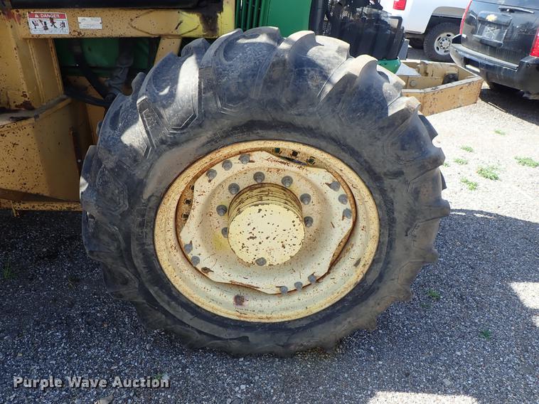 image for item DF1072 2007 John Deere 7220 MFWD tractor with side boom mower