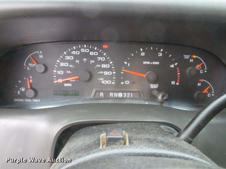 image for item DE7792 2004 Ford F350 Super Duty Crew Cab flatbed pickup truck