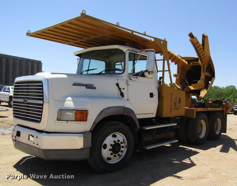 image for item DB4944 1995 Ford L9000 truck with Big John tree transplanter