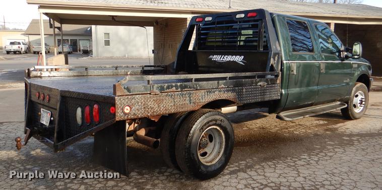 image for item DD8973 2002 Ford F350 Super Duty Crew Cab flatbed pickup truck