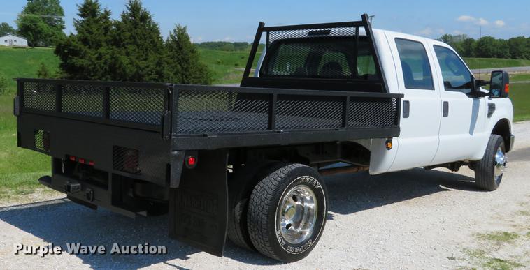 image for item DE8072 2008 Ford F350 Super Duty XL Crew Cab flatbed pickup truck
