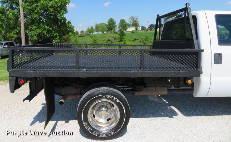 image for item DE8072 2008 Ford F350 Super Duty XL Crew Cab flatbed pickup truck