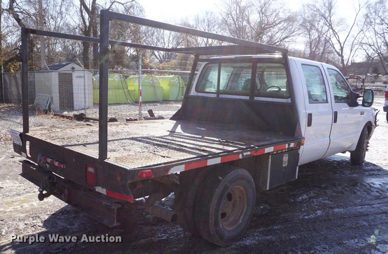 image for item DF7624 1999 Ford F350 Super Duty Crew Cab flatbed pickup truck