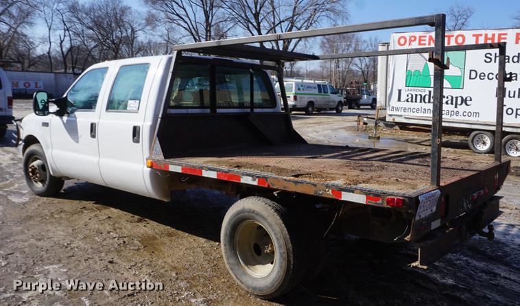 image for item DF7624 1999 Ford F350 Super Duty Crew Cab flatbed pickup truck