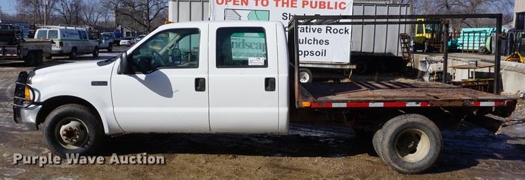 image for item DF7624 1999 Ford F350 Super Duty Crew Cab flatbed pickup truck