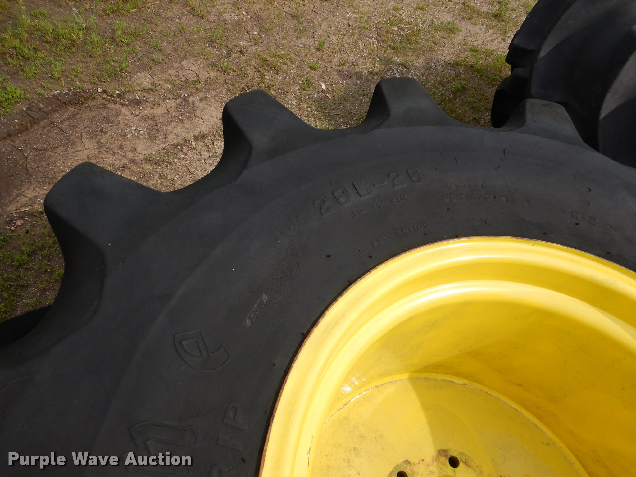 (2) 28L26 tires and wheels in Belton, MO Item DY9813 sold Purple Wave