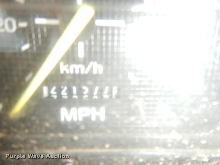 image for item DE3954 1998 Ford F700 dump flatbed truck