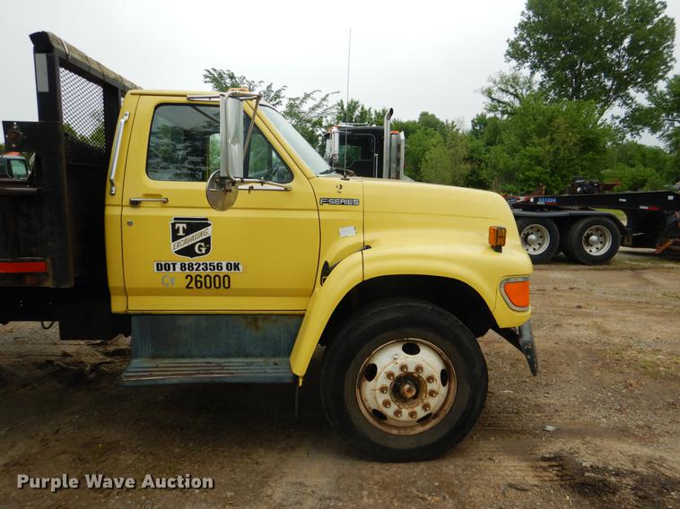 image for item DE3954 1998 Ford F700 dump flatbed truck