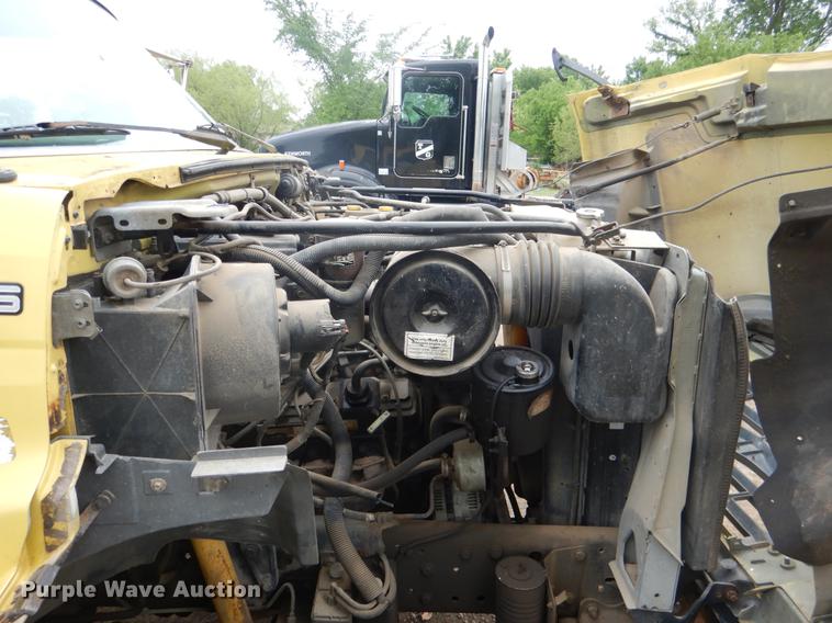 image for item DE3954 1998 Ford F700 dump flatbed truck