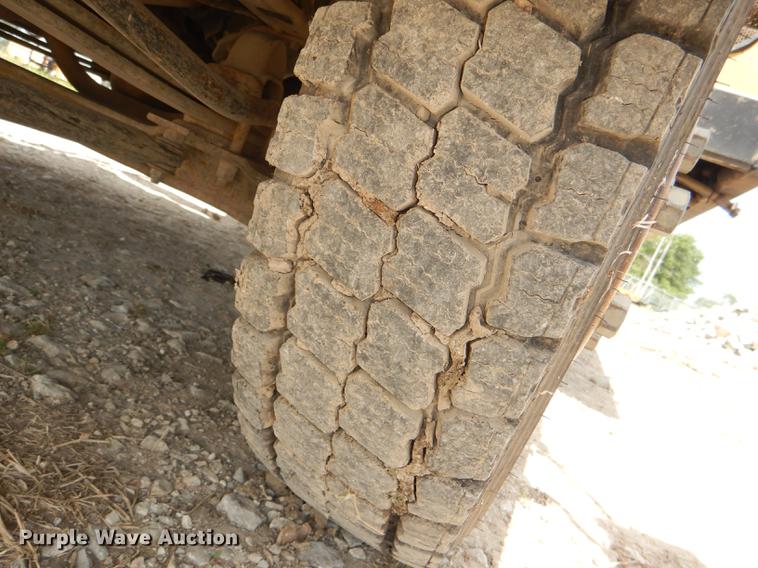 image for item DG1125 2003 GMC W5500 TrucKat flatbed truck