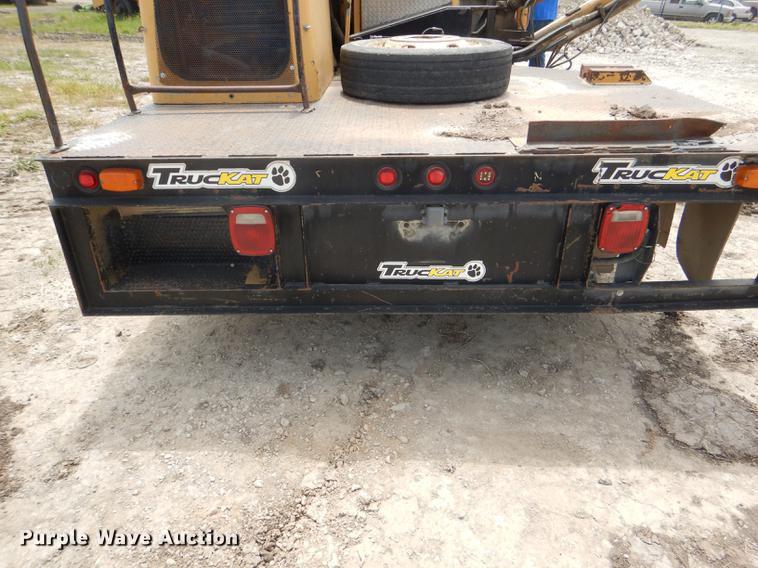 image for item DG1125 2003 GMC W5500 TrucKat flatbed truck