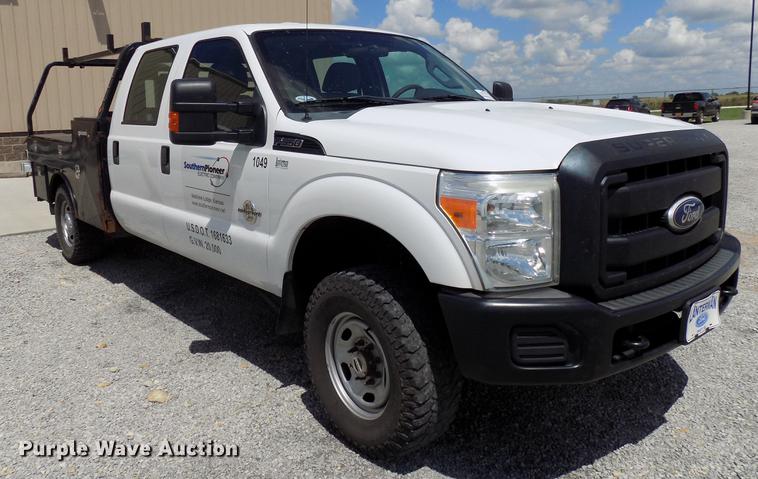 image for item DB9529 2011 Ford F350 Super Duty Crew Cab utility bed pickup truck