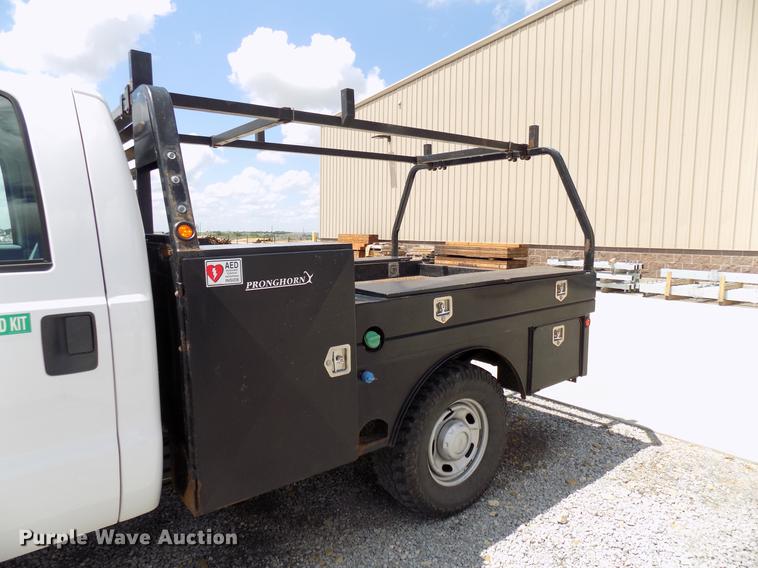 image for item DB9529 2011 Ford F350 Super Duty Crew Cab utility bed pickup truck