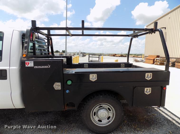 image for item DB9529 2011 Ford F350 Super Duty Crew Cab utility bed pickup truck