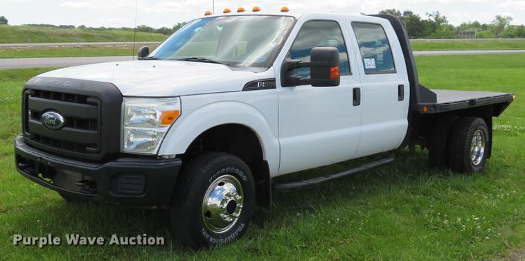 image for item DE8104 2011 Ford F350 Super Duty XL Crew Cab flatbed pickup truck