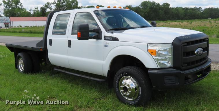 image for item DE8104 2011 Ford F350 Super Duty XL Crew Cab flatbed pickup truck