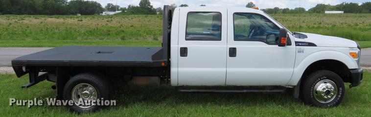 image for item DE8104 2011 Ford F350 Super Duty XL Crew Cab flatbed pickup truck