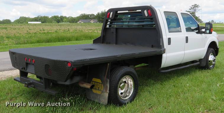 image for item DE8104 2011 Ford F350 Super Duty XL Crew Cab flatbed pickup truck