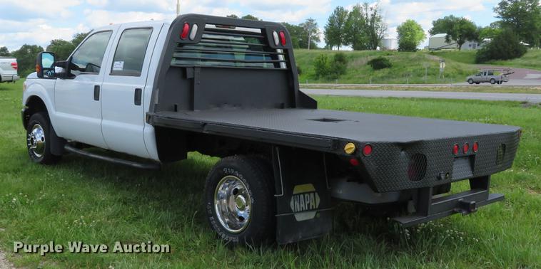 image for item DE8104 2011 Ford F350 Super Duty XL Crew Cab flatbed pickup truck