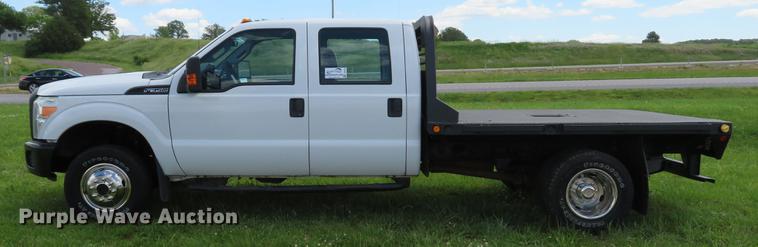 image for item DE8104 2011 Ford F350 Super Duty XL Crew Cab flatbed pickup truck