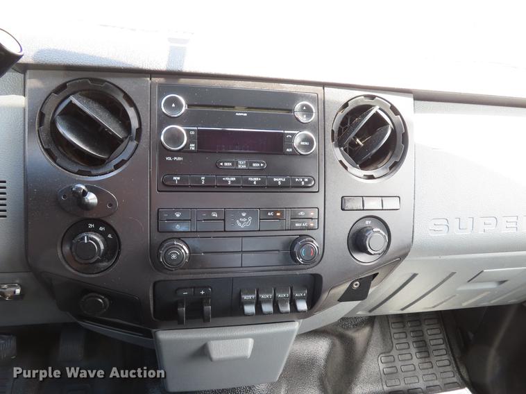 image for item DE8104 2011 Ford F350 Super Duty XL Crew Cab flatbed pickup truck